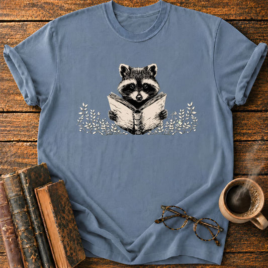 Raccoon Reading Among Leaves T-Shirt
