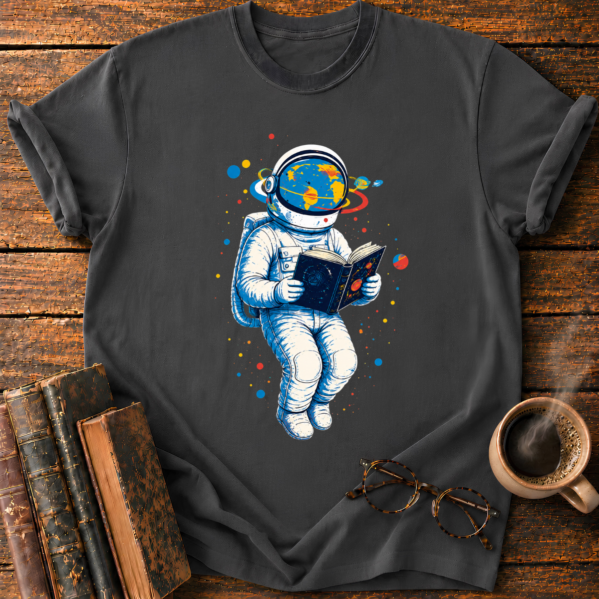 Astronaut Reading Among Colorful Planets T-Shirt
