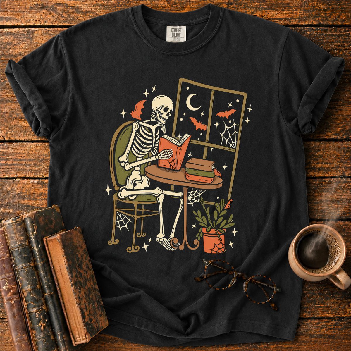 Cozy Skeleton Reading by Moonlight T-Shirt