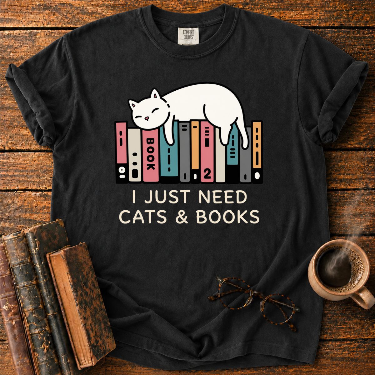 Sleeping Cat Among Colorful Books T-Shirt