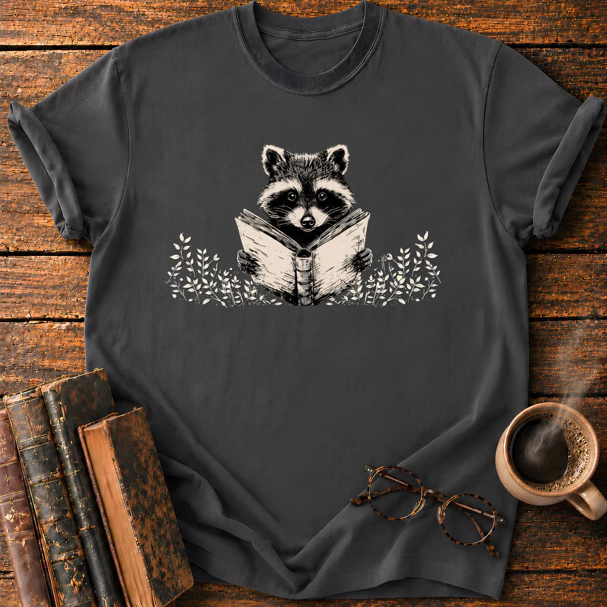 Raccoon Reading Among Leaves T-Shirt