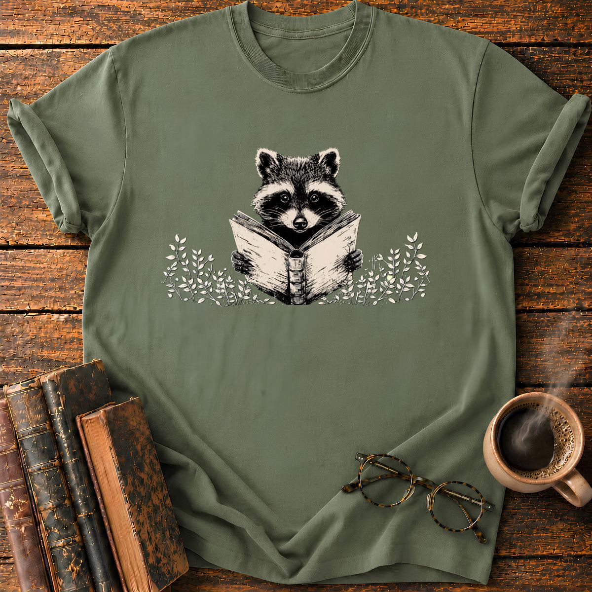 Raccoon Reading Among Leaves T-Shirt