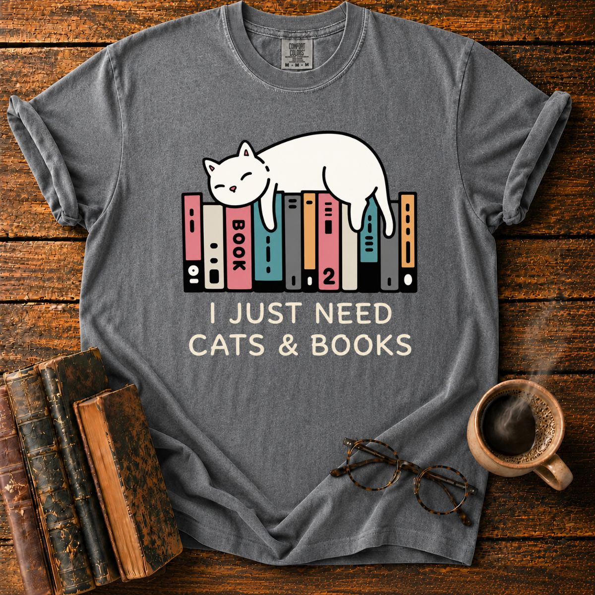 Sleeping Cat Among Colorful Books T-Shirt