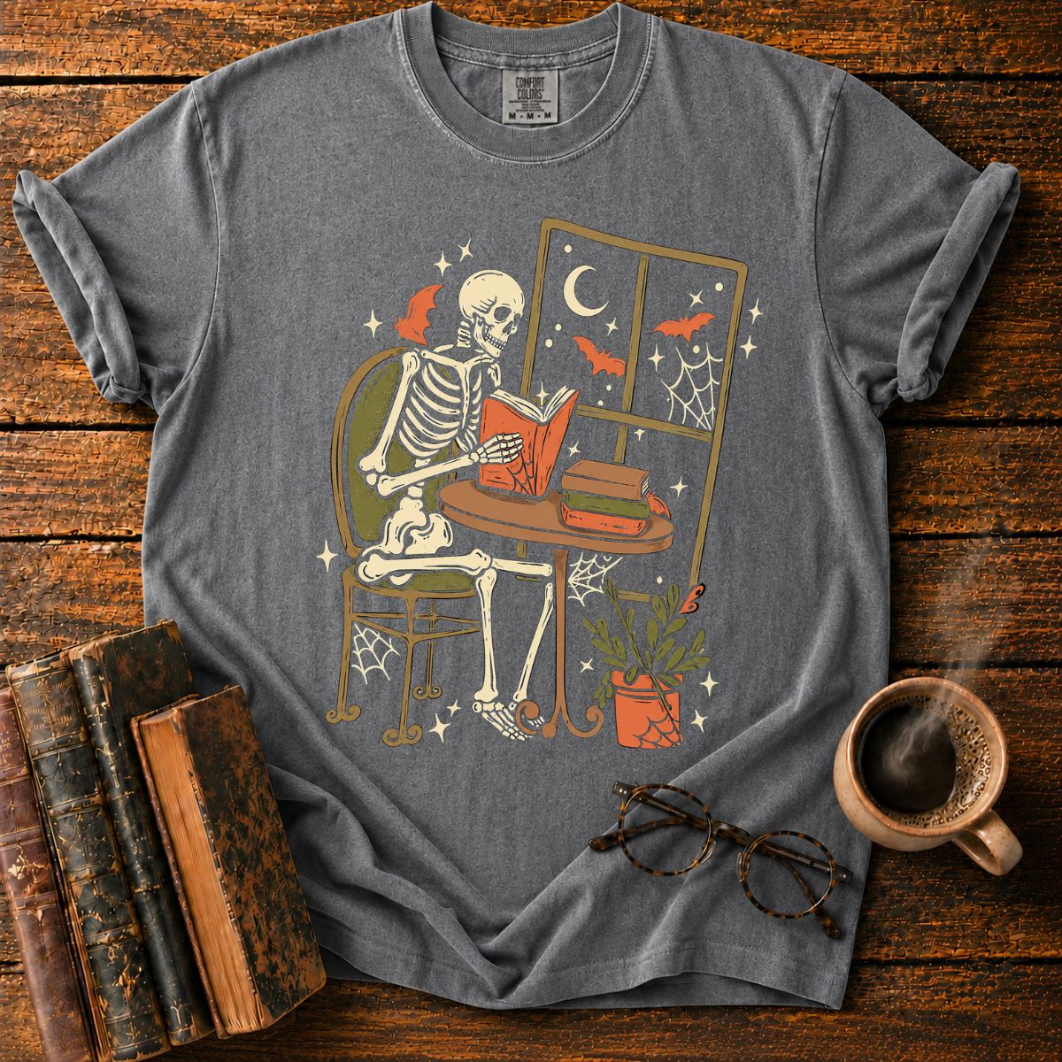 Cozy Skeleton Reading by Moonlight T-Shirt