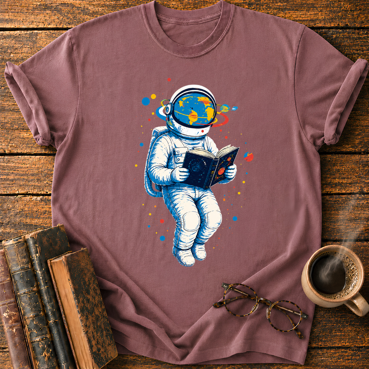 Astronaut Reading Among Colorful Planets T-Shirt