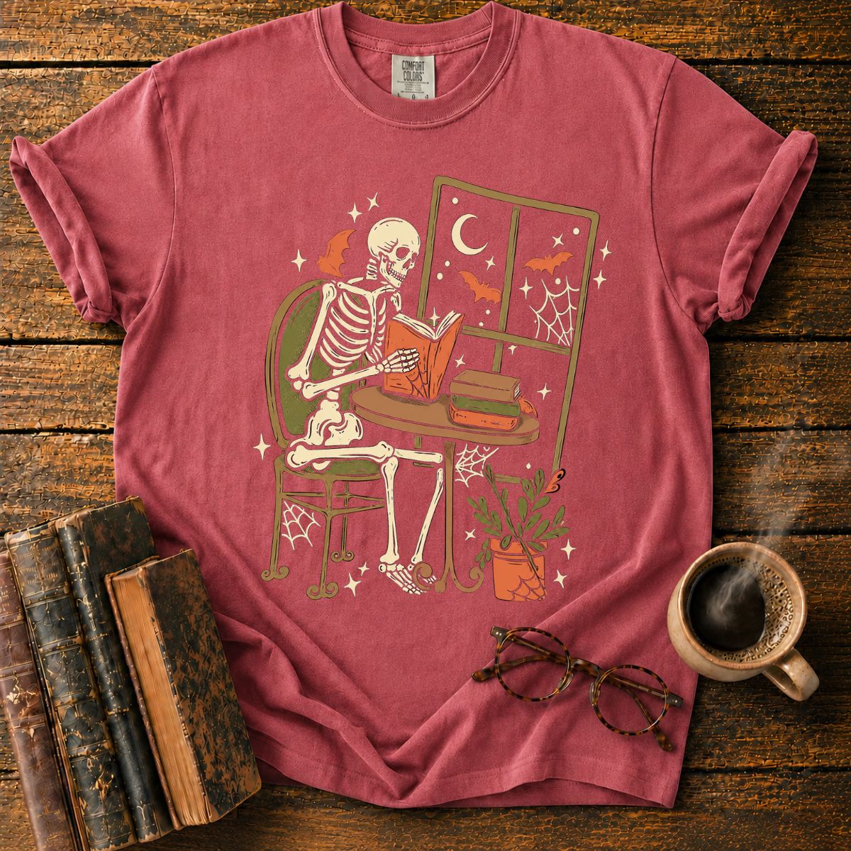 Cozy Skeleton Reading by Moonlight T-Shirt