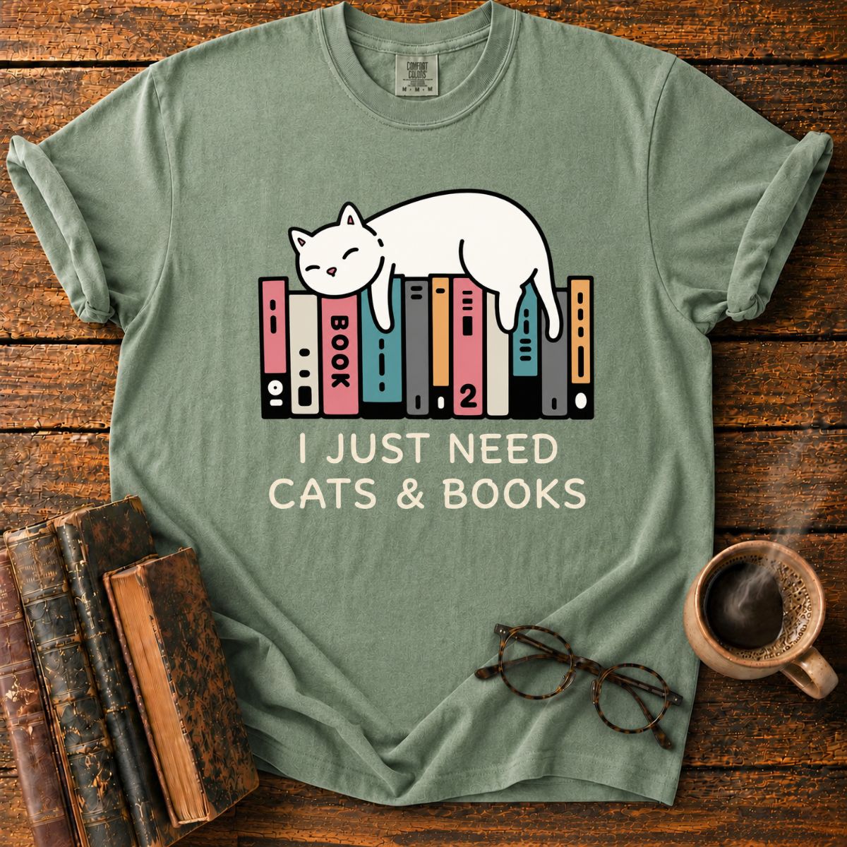 Sleeping Cat Among Colorful Books T-Shirt
