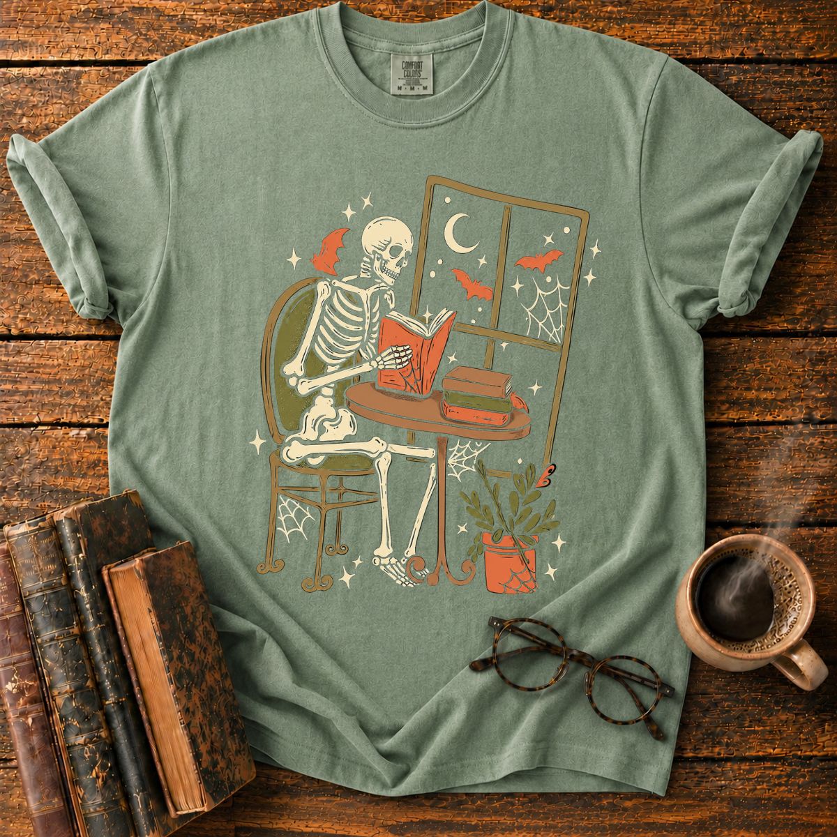 Cozy Skeleton Reading by Moonlight T-Shirt