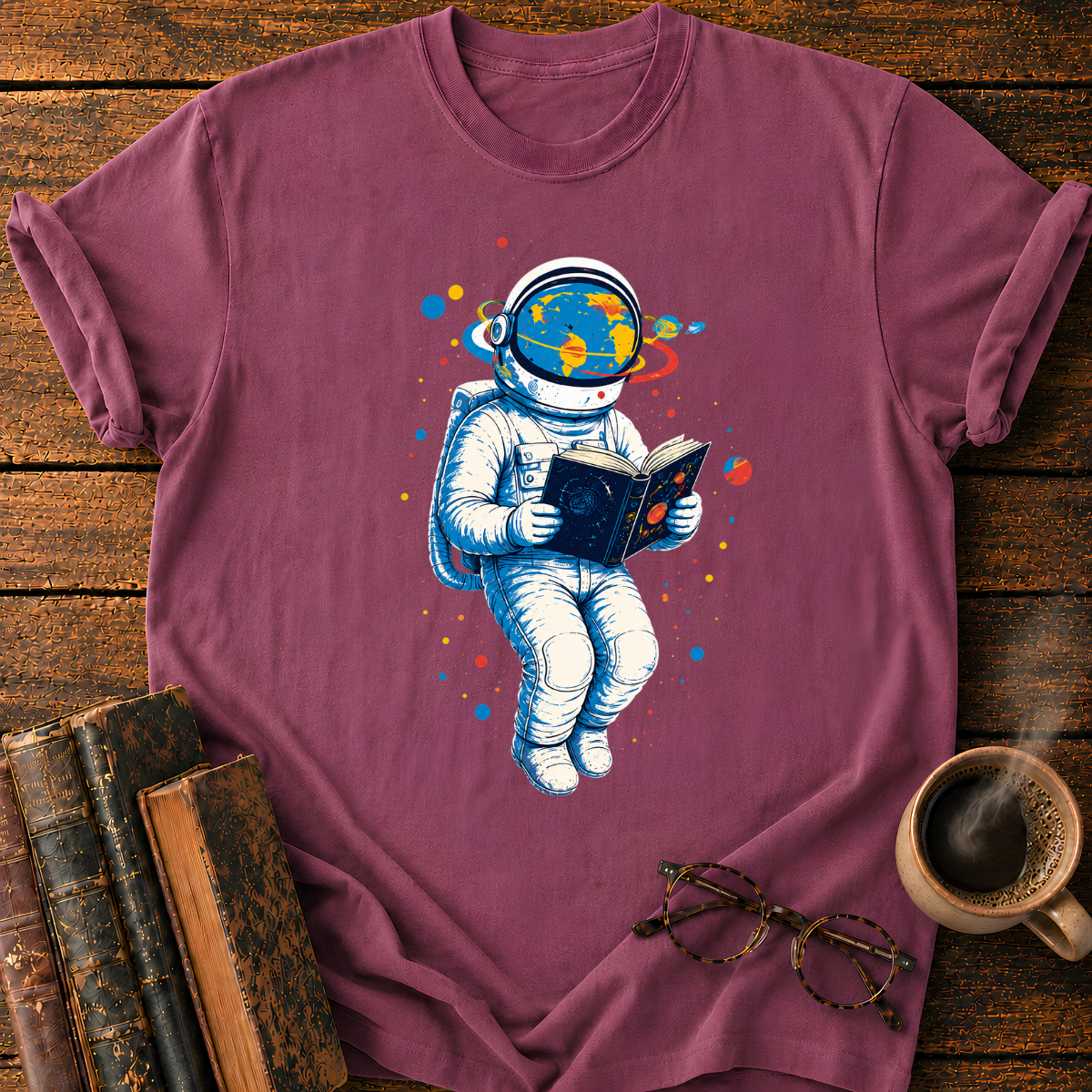 Astronaut Reading Among Colorful Planets T-Shirt