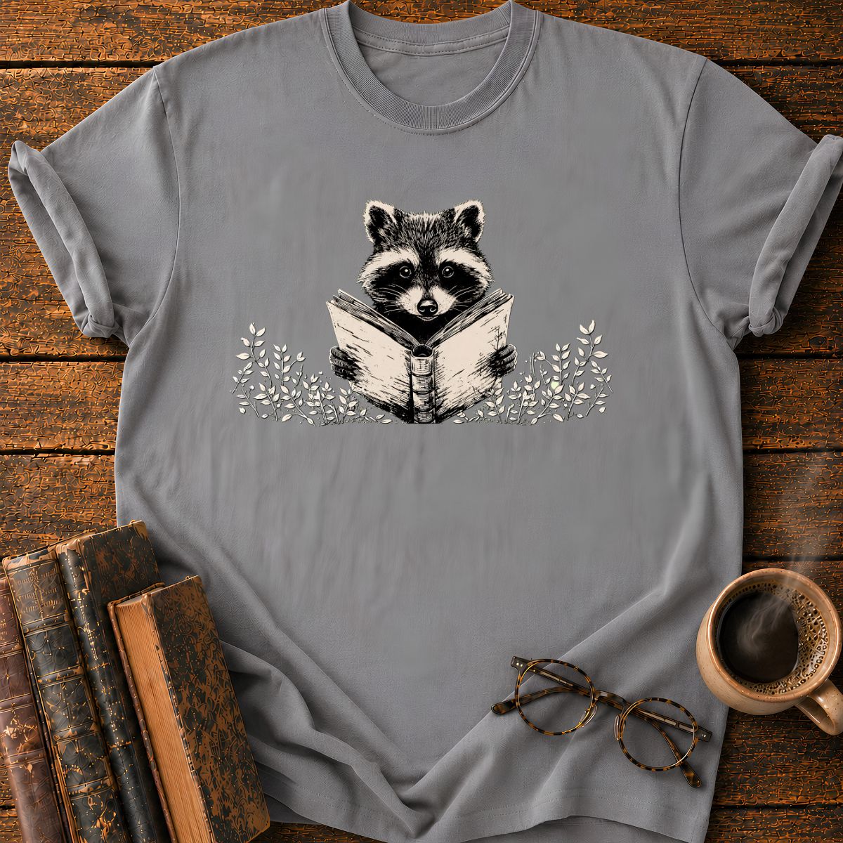 Raccoon Reading Among Leaves T-Shirt