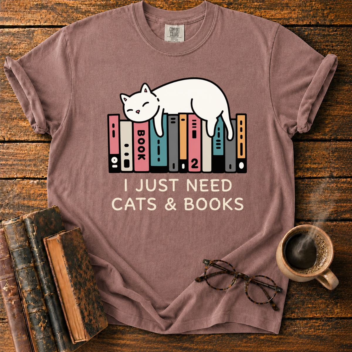 Sleeping Cat Among Colorful Books T-Shirt