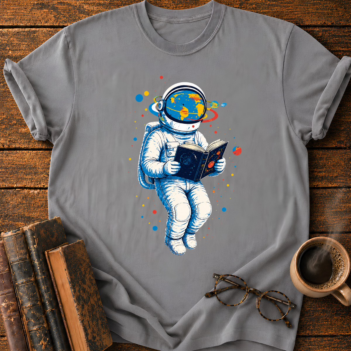 Astronaut Reading Among Colorful Planets T-Shirt