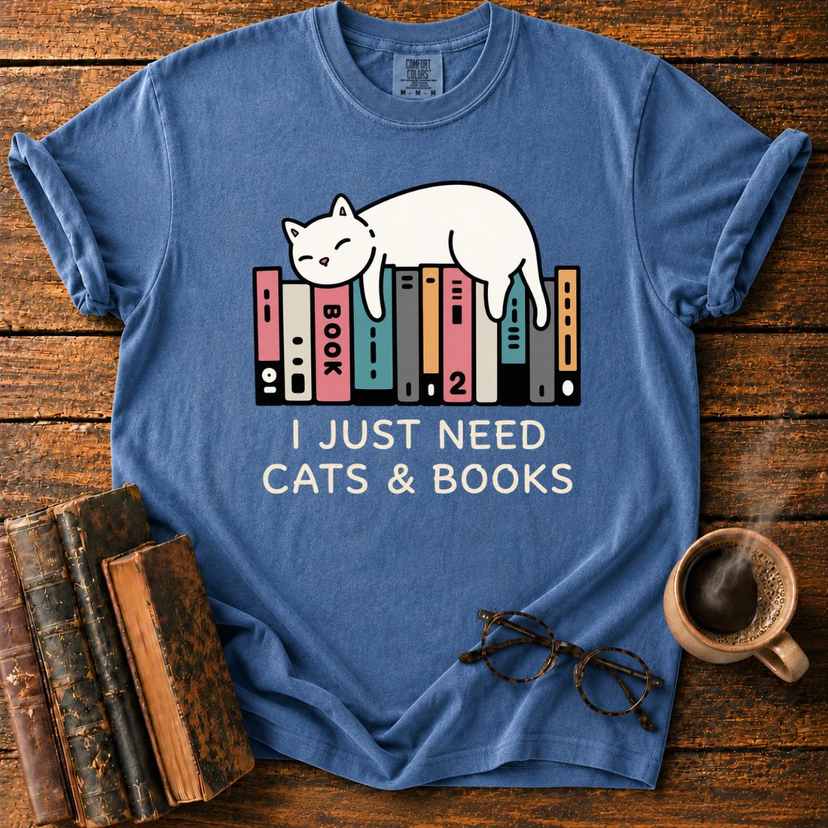 Sleeping Cat Among Colorful Books T-Shirt