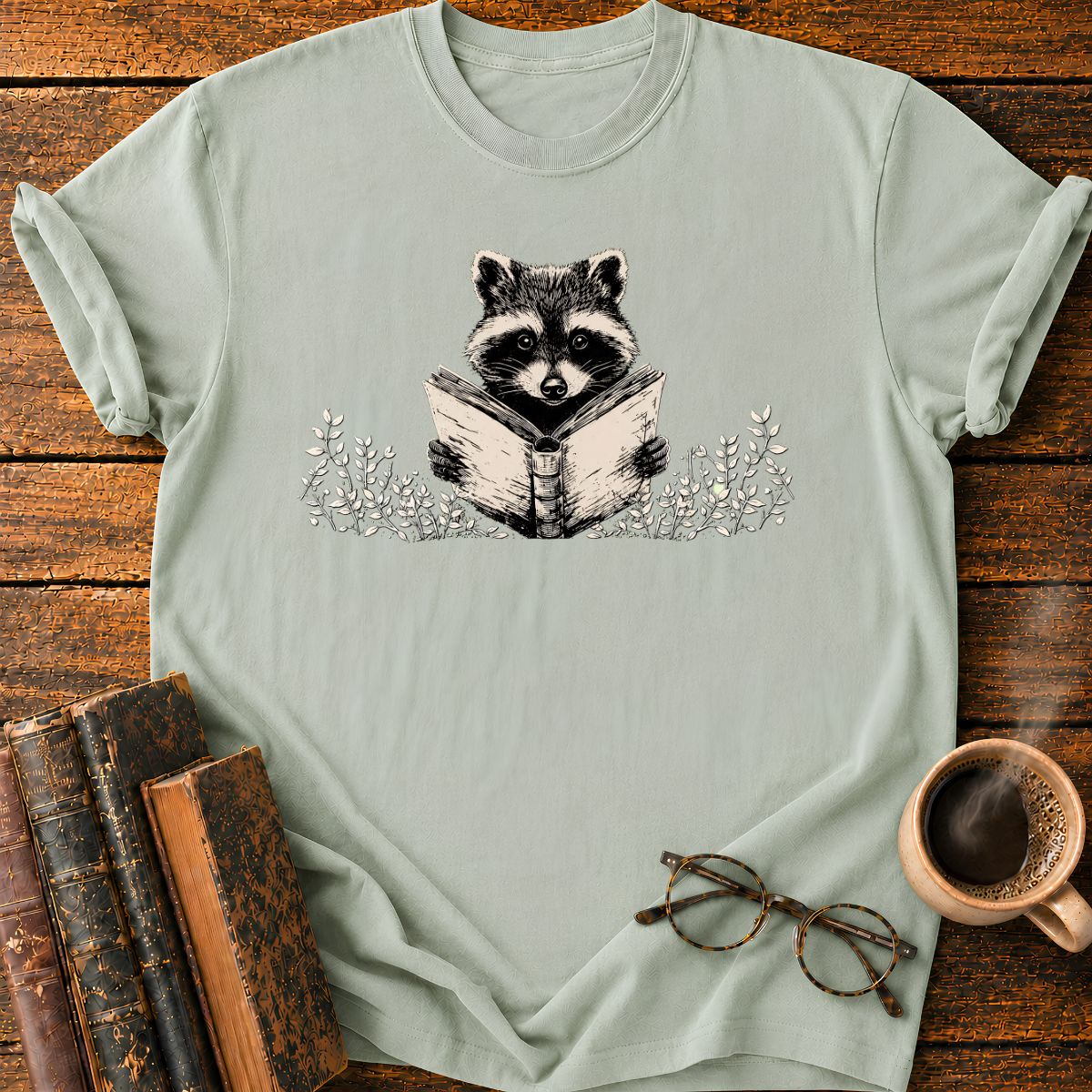 Raccoon Reading Among Leaves T-Shirt