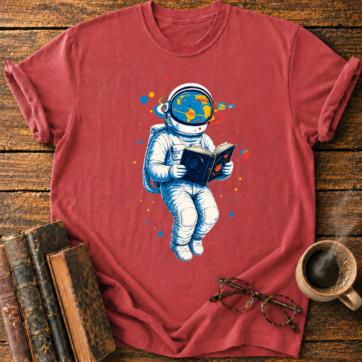Astronaut Reading Among Colorful Planets T-Shirt