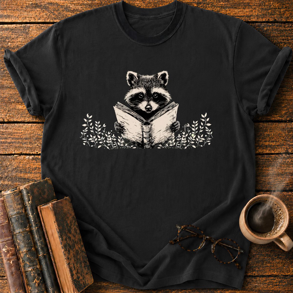 Raccoon Reading Among Leaves T-Shirt
