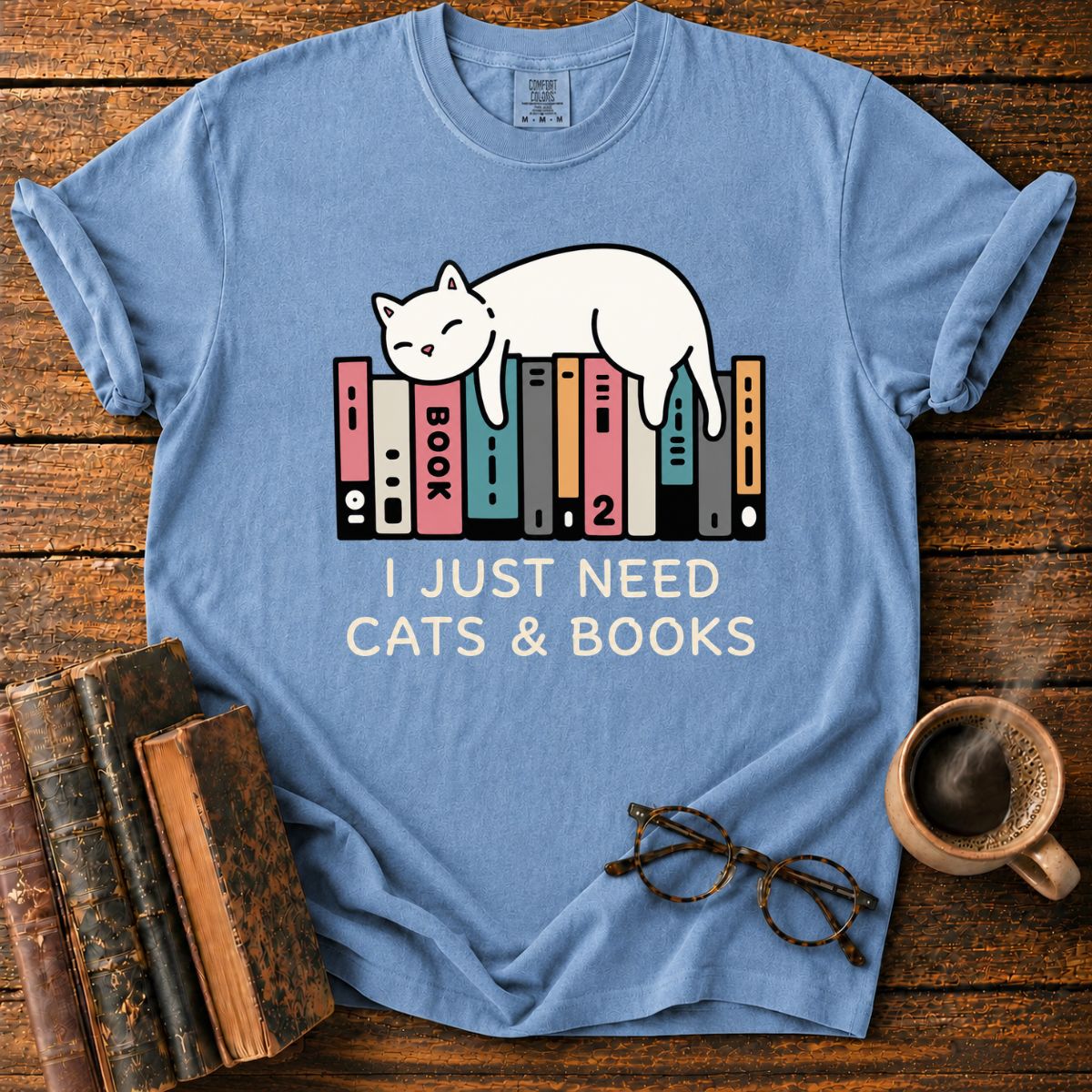 Sleeping Cat Among Colorful Books T-Shirt