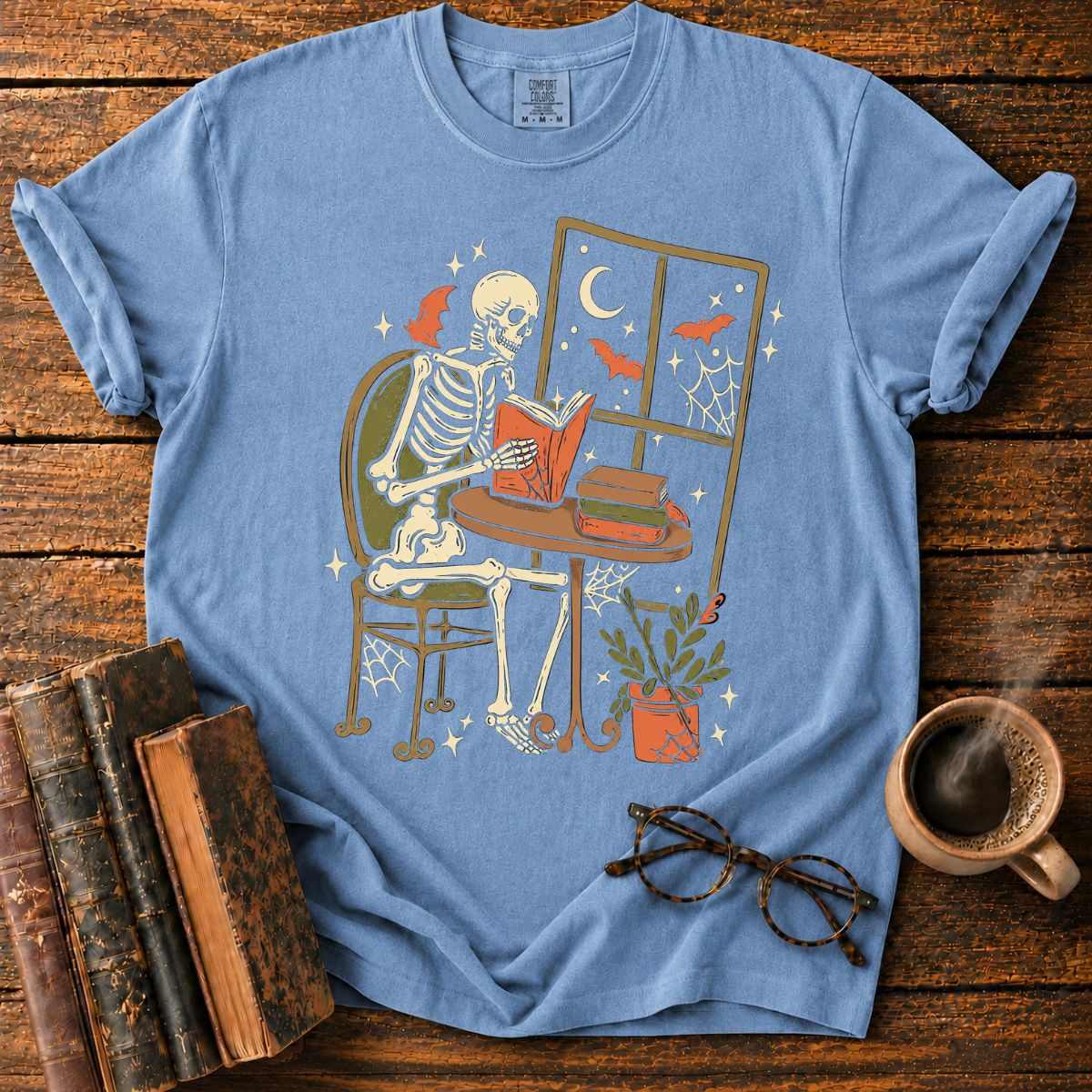 Cozy Skeleton Reading by Moonlight T-Shirt