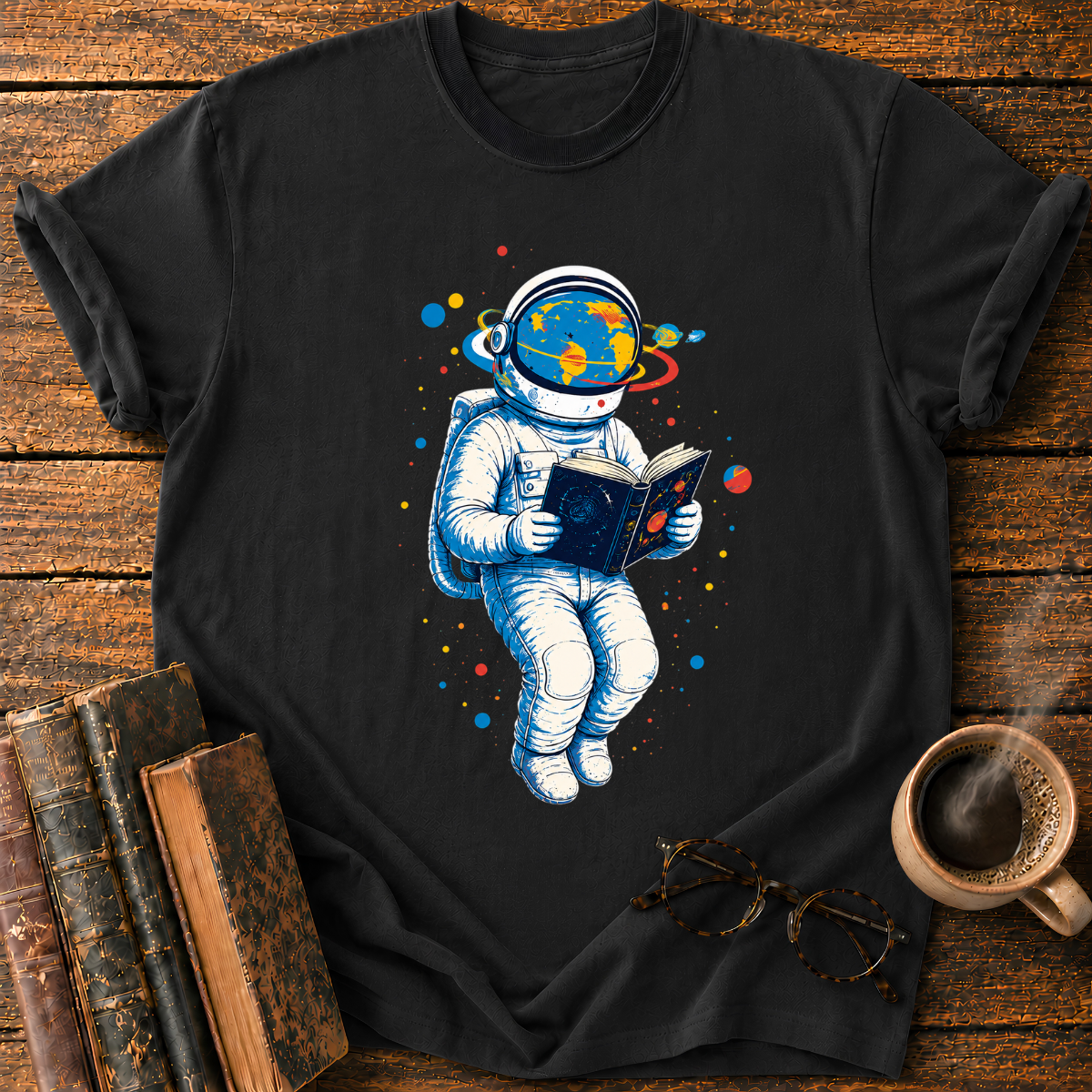 Astronaut Reading Among Colorful Planets T-Shirt