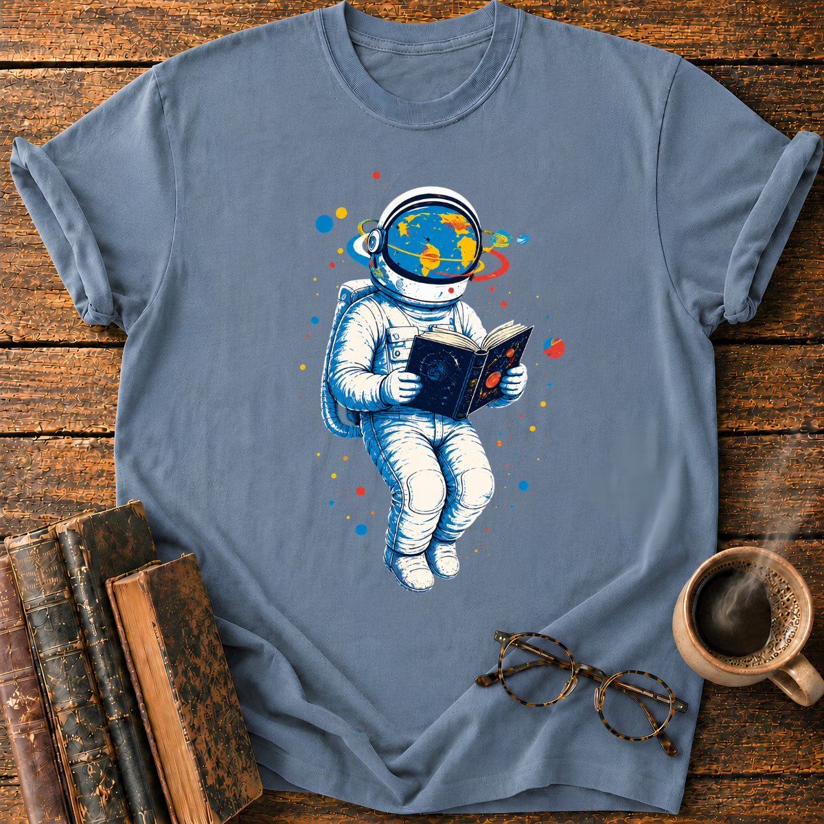 Astronaut Reading Among Colorful Planets T-Shirt