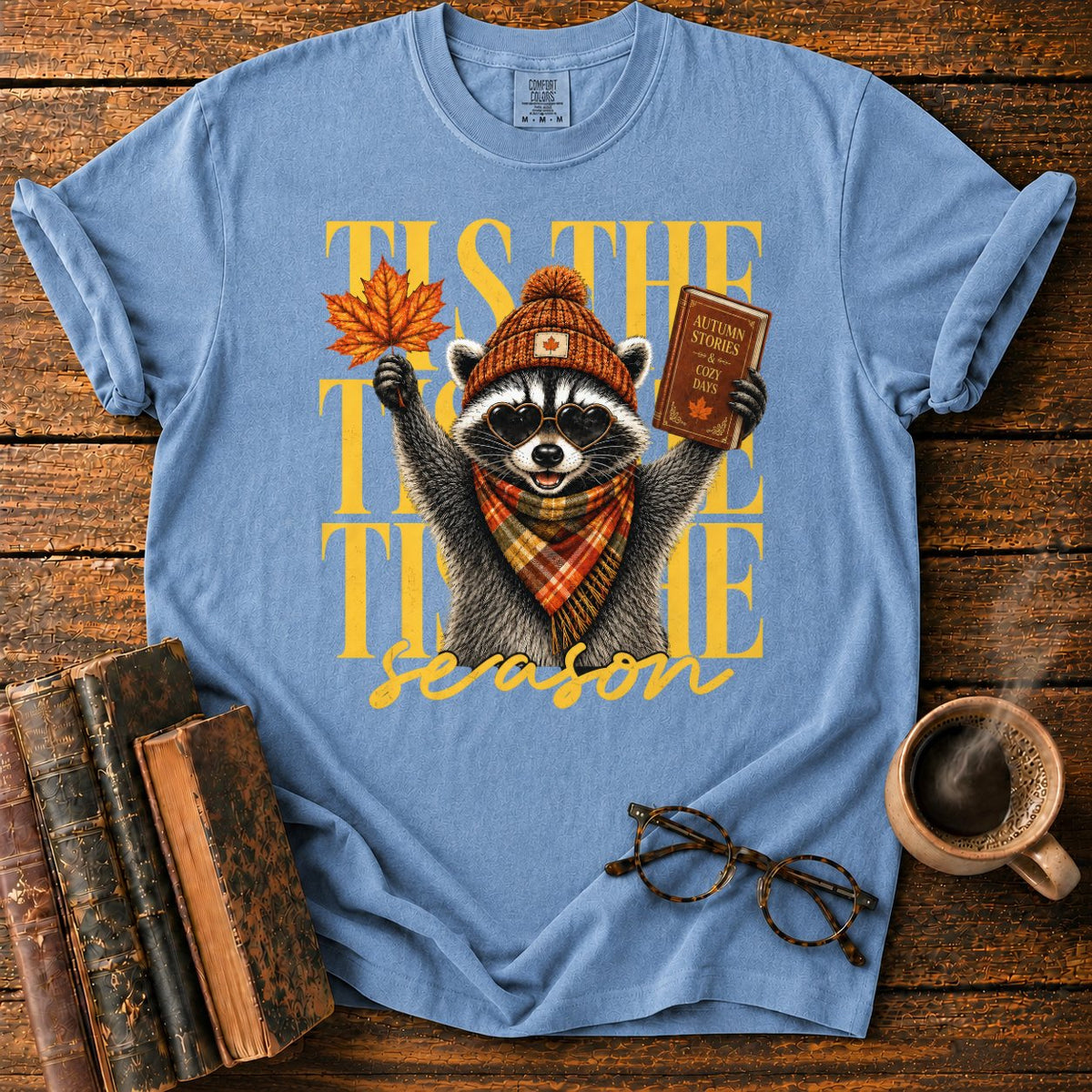 Cozy Autumn Raccoon Celebration T-Shirt in Blue Jean – BooksThreads