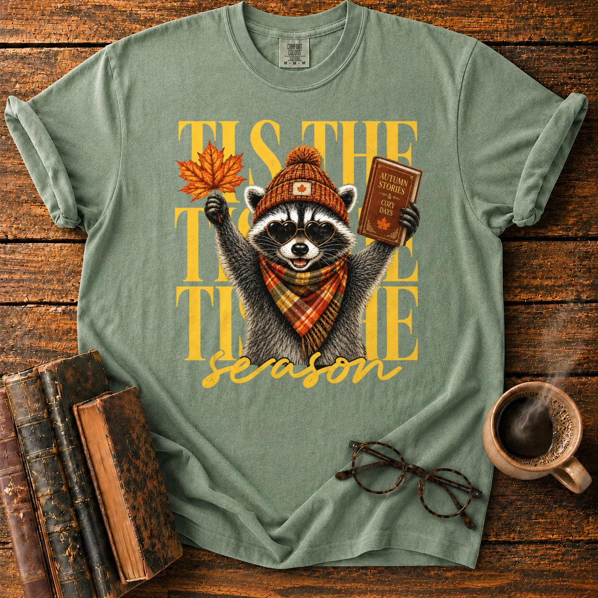 Cozy Autumn Raccoon Celebration T-Shirt in Moss – BooksThreads
