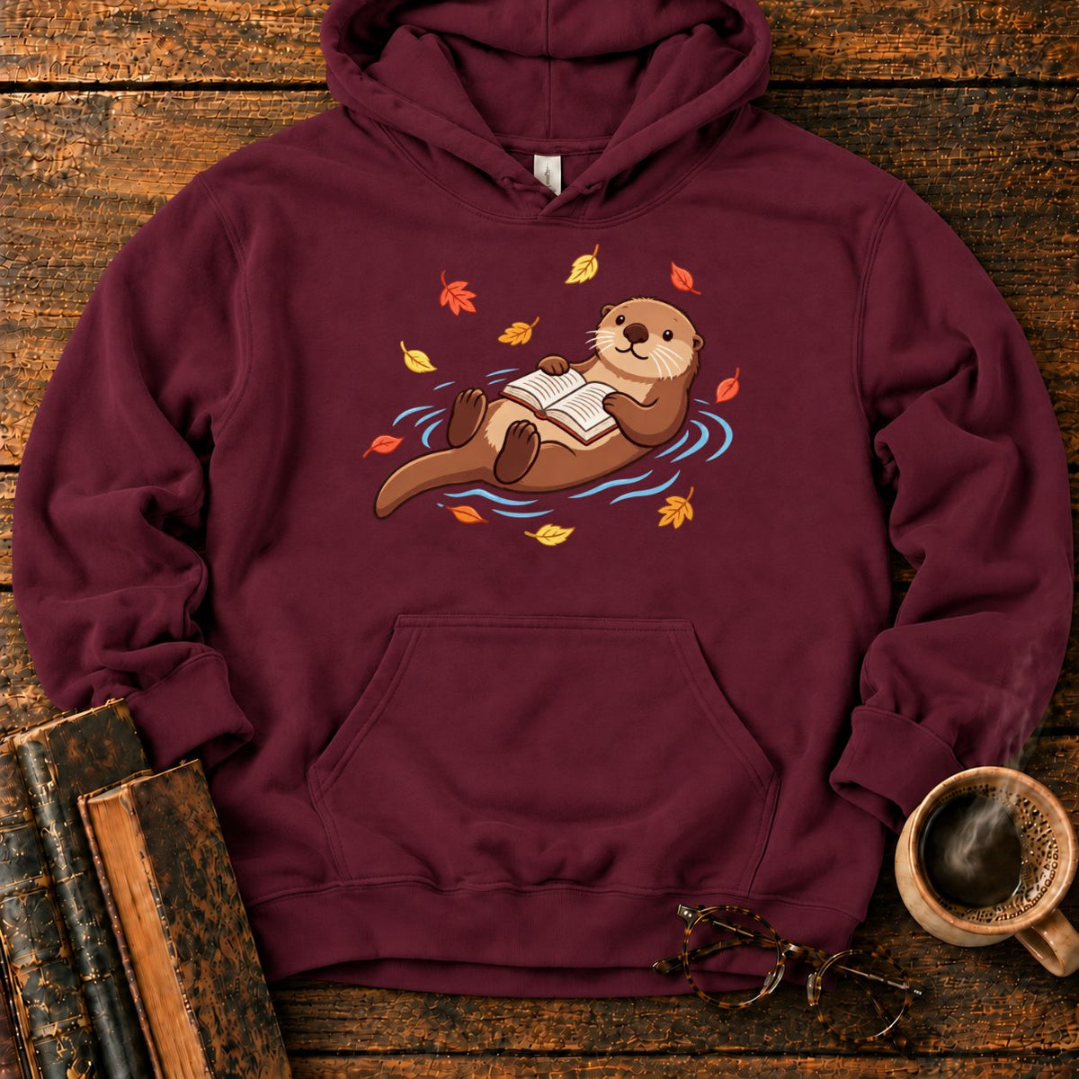 Floating Otter Reading Among Autumn Leaves Hoodie in Maroon – BooksThreads