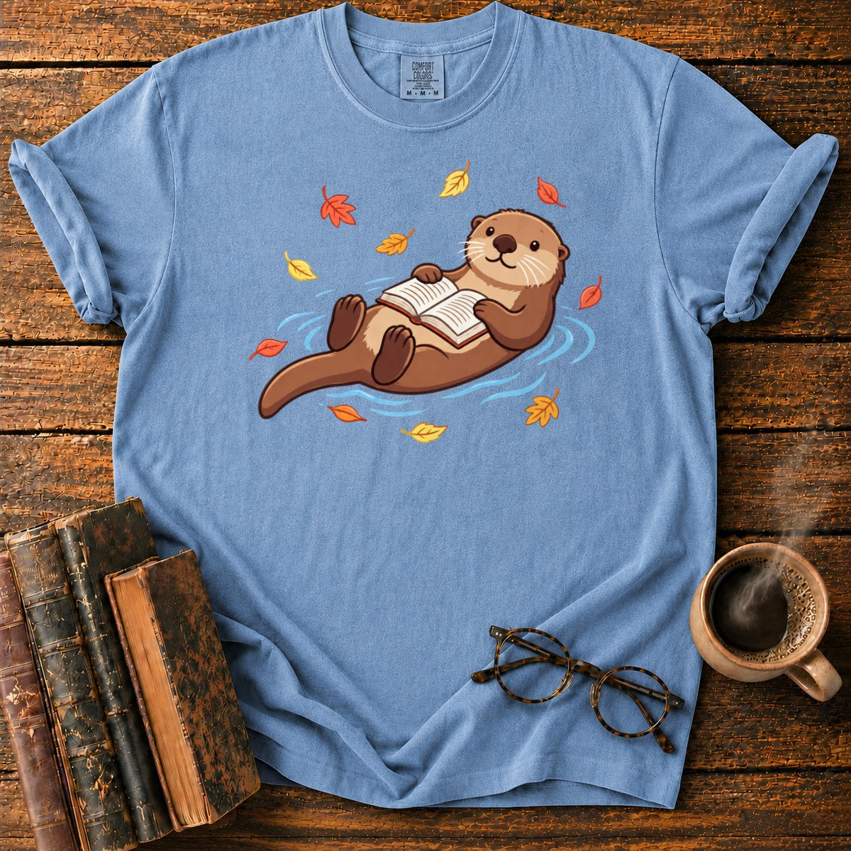 Floating Otter Reading Among Autumn Leaves T-Shirt in Blue Jean – BooksThreads