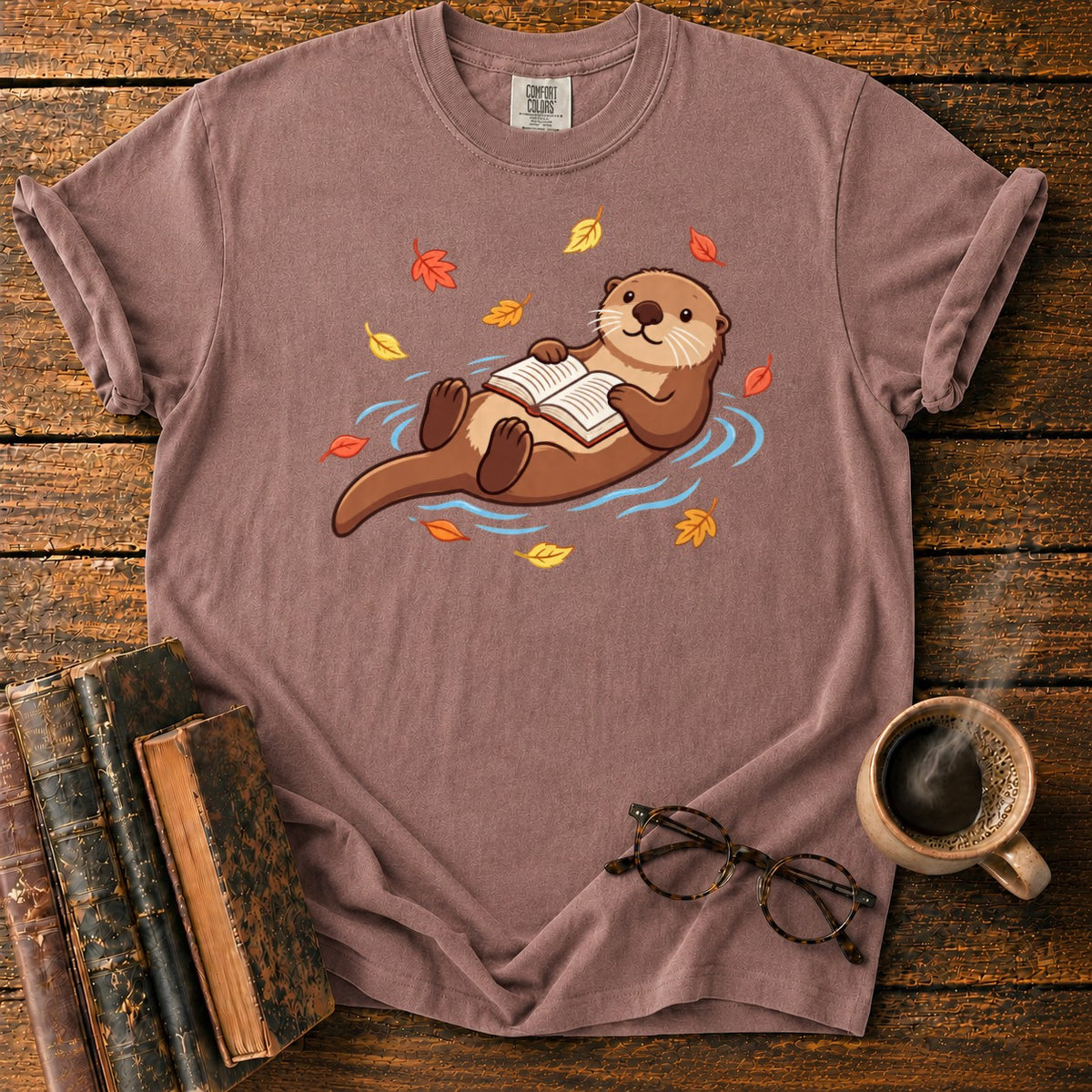 Floating Otter Reading Among Autumn Leaves T-Shirt in Espresso – BooksThreads