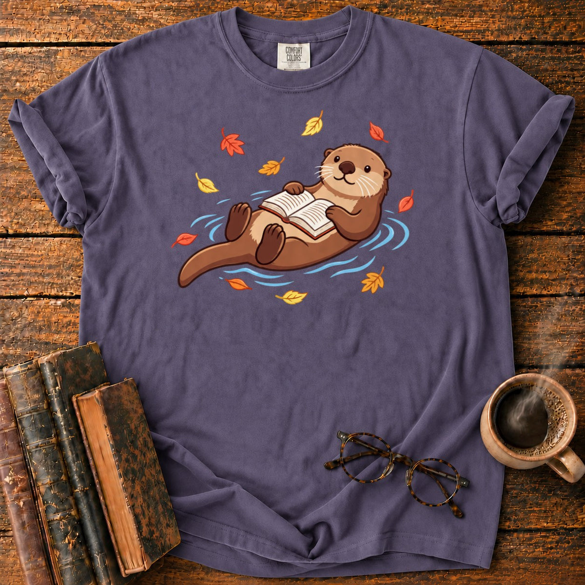 Floating Otter Reading Among Autumn Leaves T-Shirt in Grape – BooksThreads