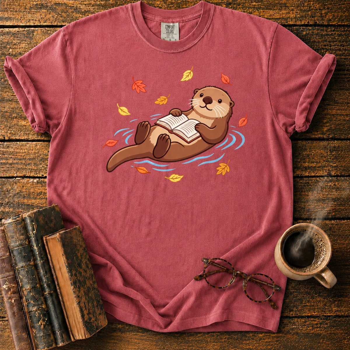 Floating Otter Reading Among Autumn Leaves T-Shirt in Watermelon – BooksThreads