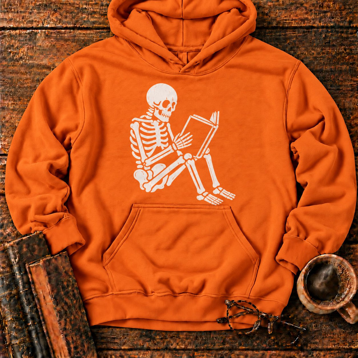 Seated Skeleton Reading An Open Book Hoodie in Orange – BooksThreads