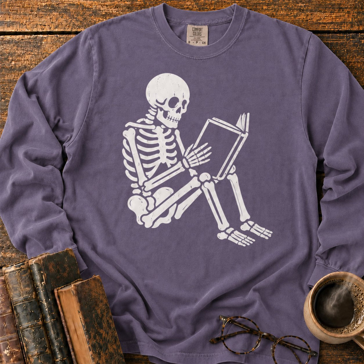 Seated Skeleton Reading An Open Book LS T-Shirt in Grape – BooksThreads