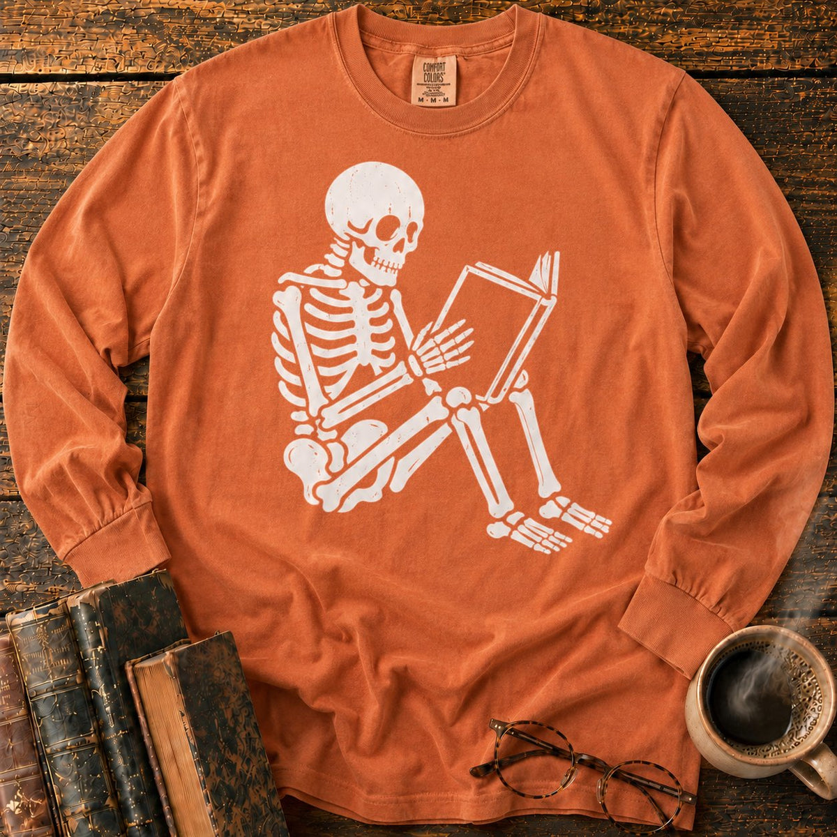 Seated Skeleton Reading An Open Book LS T-Shirt in Yam – BooksThreads