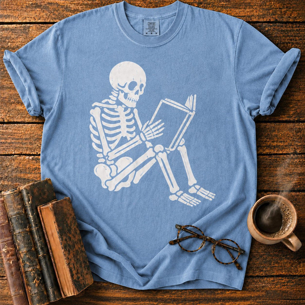 Seated Skeleton Reading An Open Book T-Shirt in Blue Jean – BooksThreads