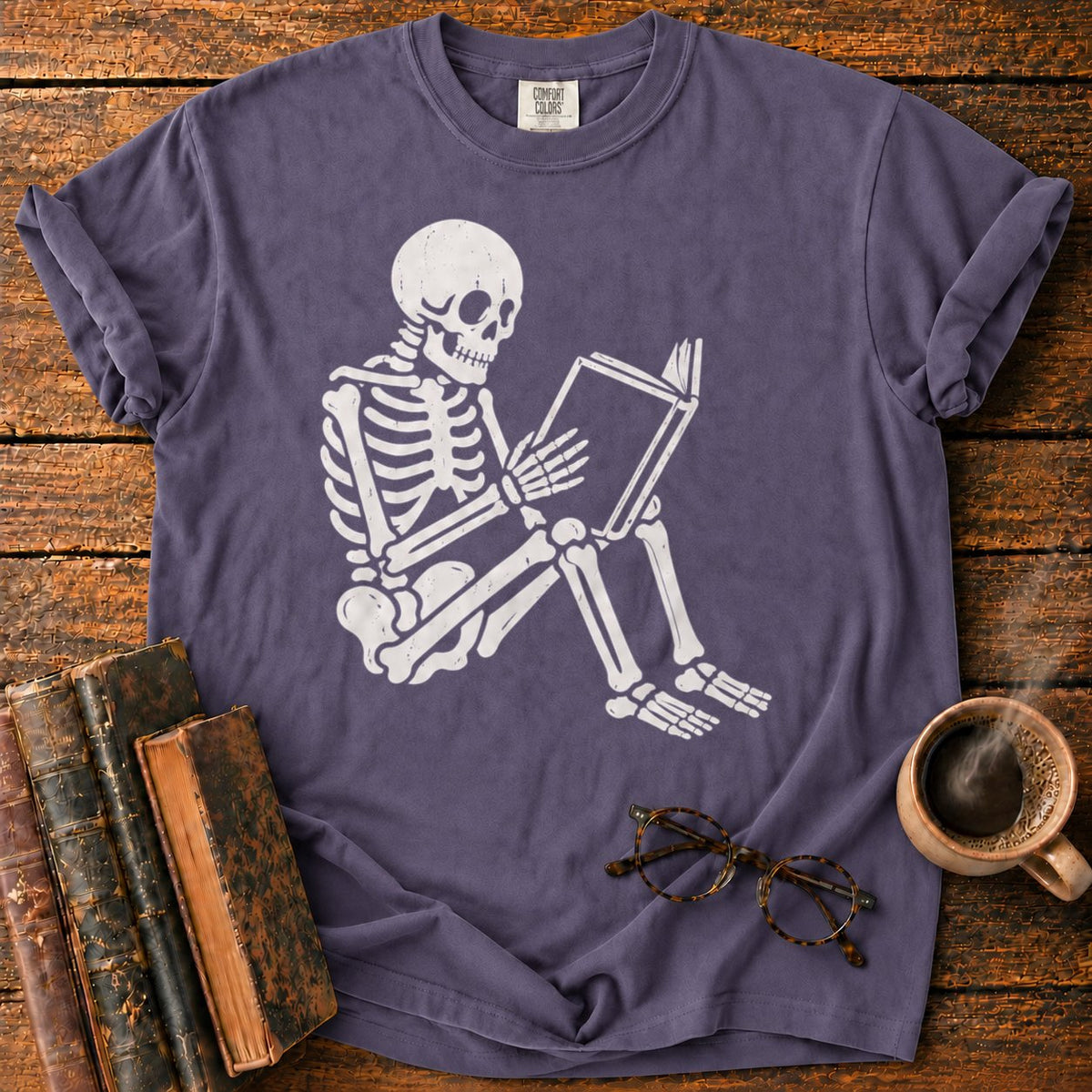 Seated Skeleton Reading An Open Book T-Shirt in Grape – BooksThreads