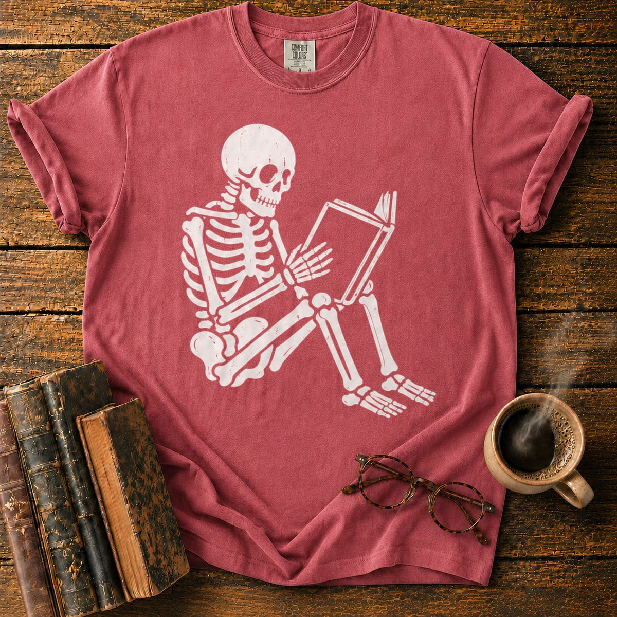 Seated Skeleton Reading An Open Book T-Shirt in Watermelon – BooksThreads