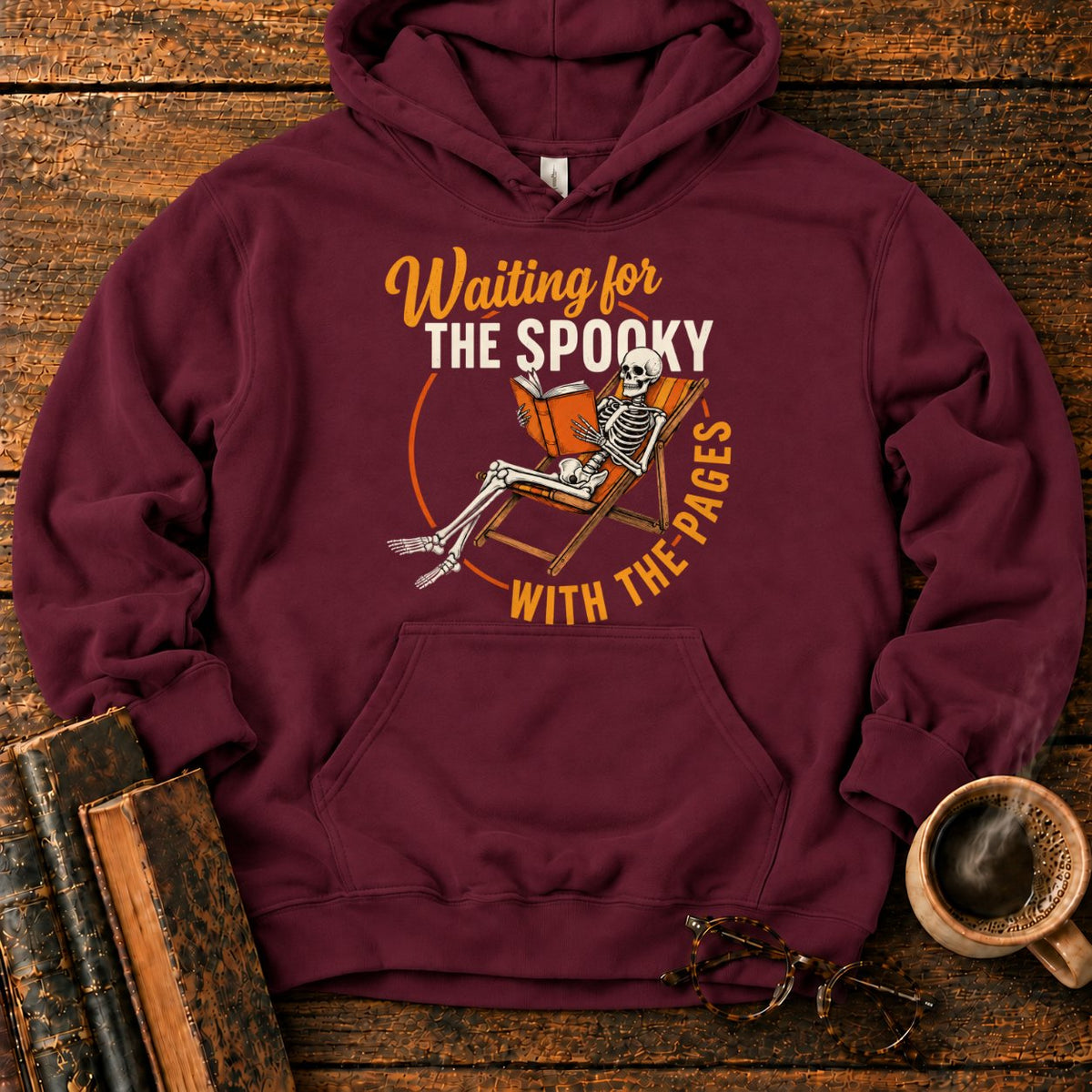 Skeleton, Book, And Chair On Black Hoodie in Maroon – BooksThreads