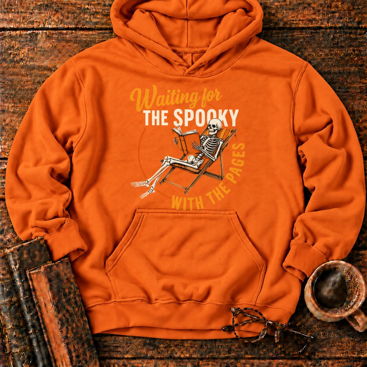 Skeleton, Book, And Chair On Black Hoodie in Orange – BooksThreads