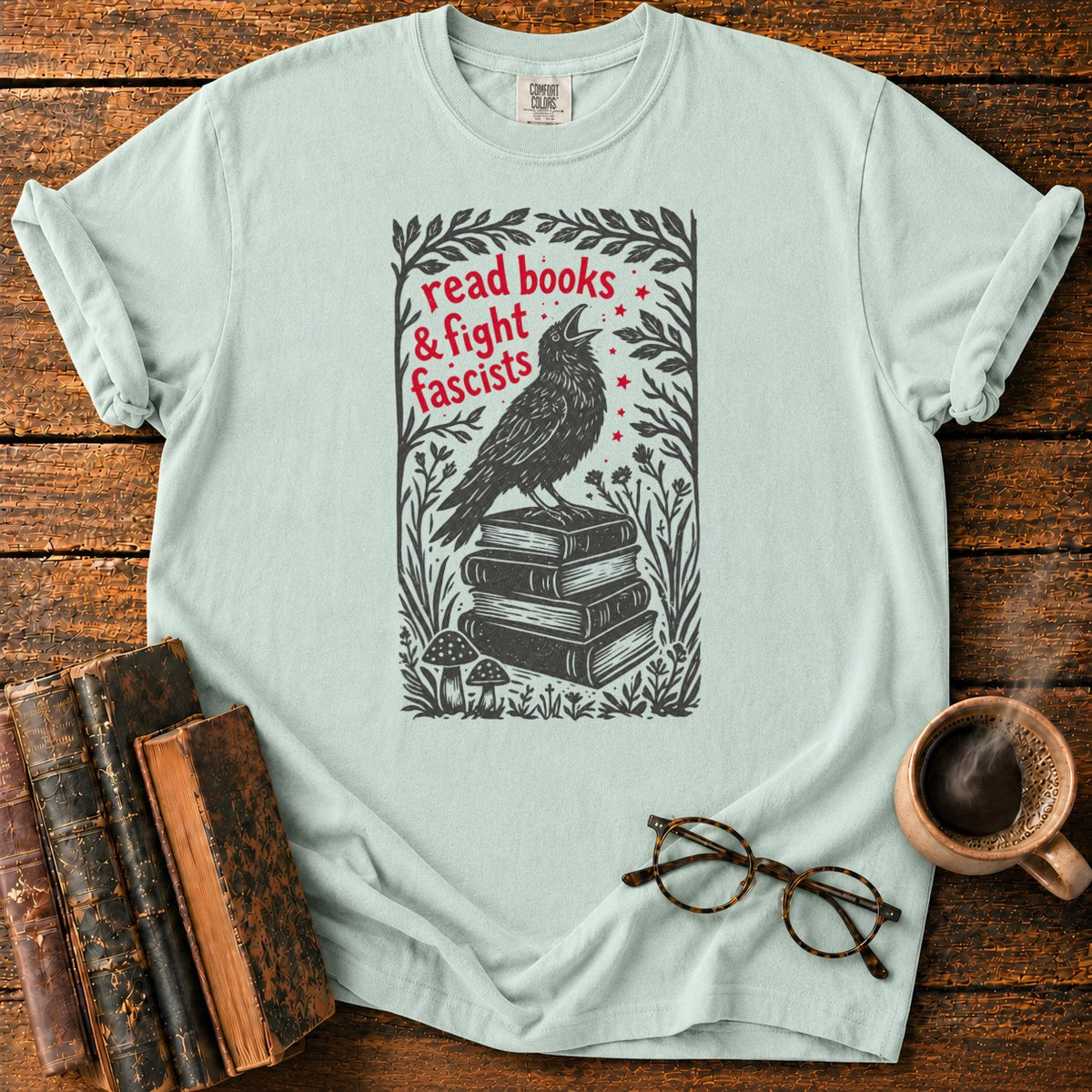 Woodcut Raven Atop Antique Books T-Shirt in Bay – BooksThreads