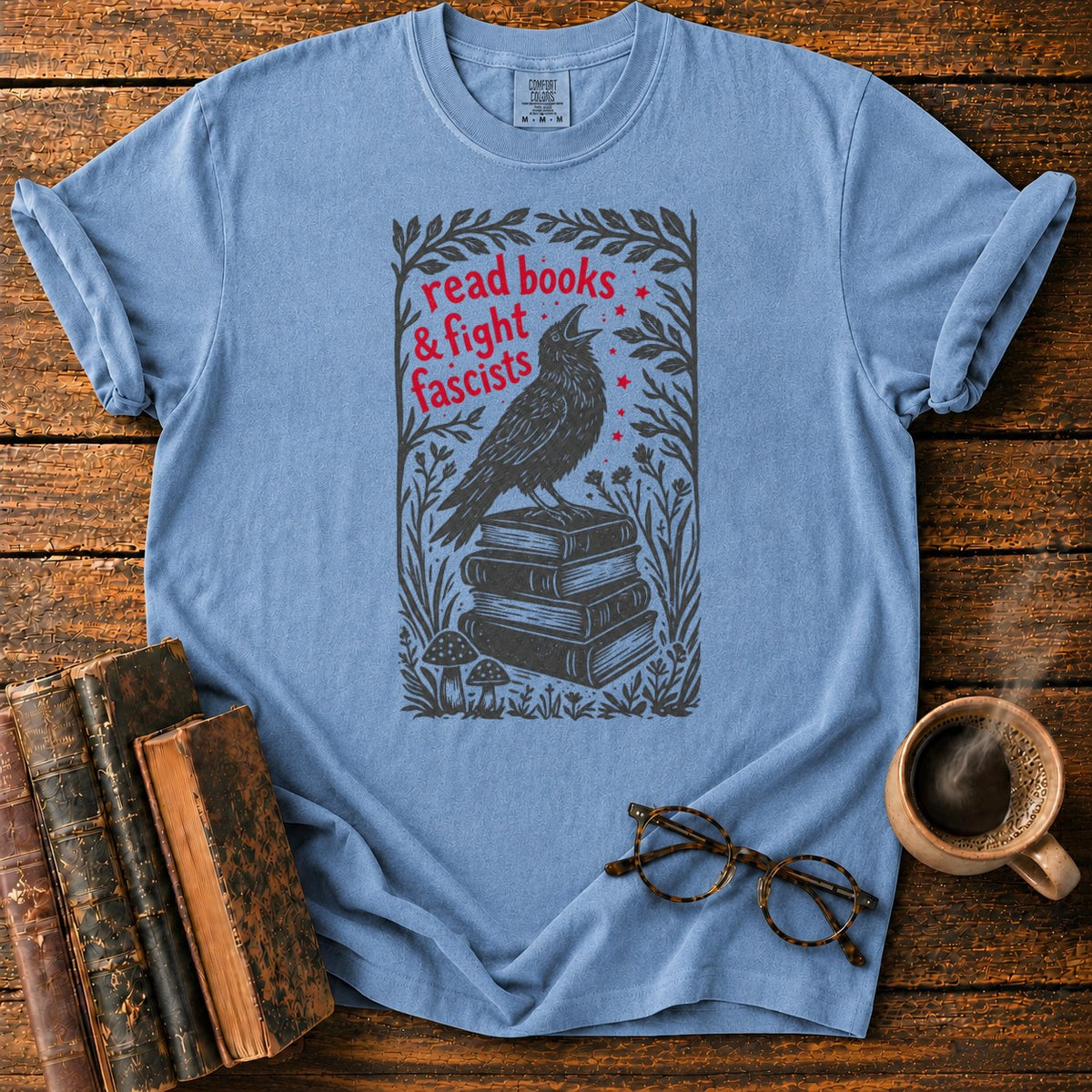 Woodcut Raven Atop Antique Books T-Shirt in Blue Jean – BooksThreads